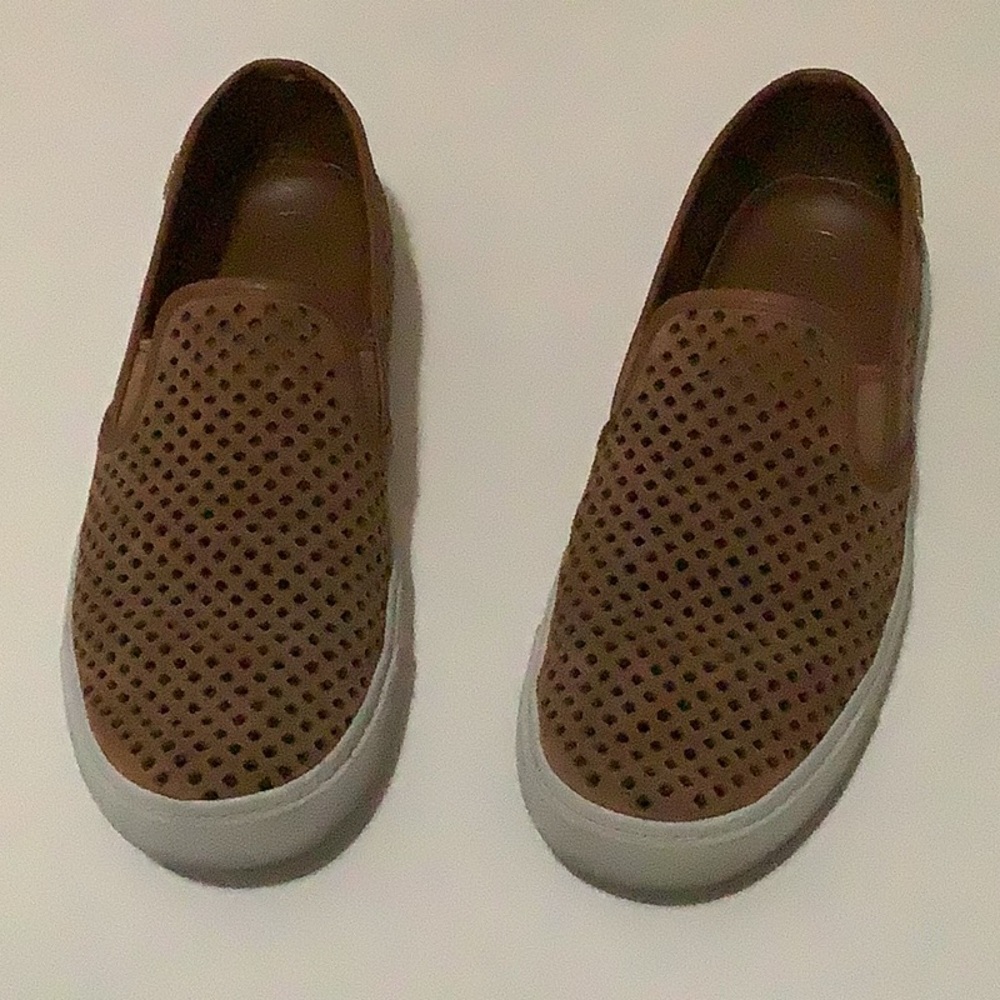 Perforated slip on shoes.